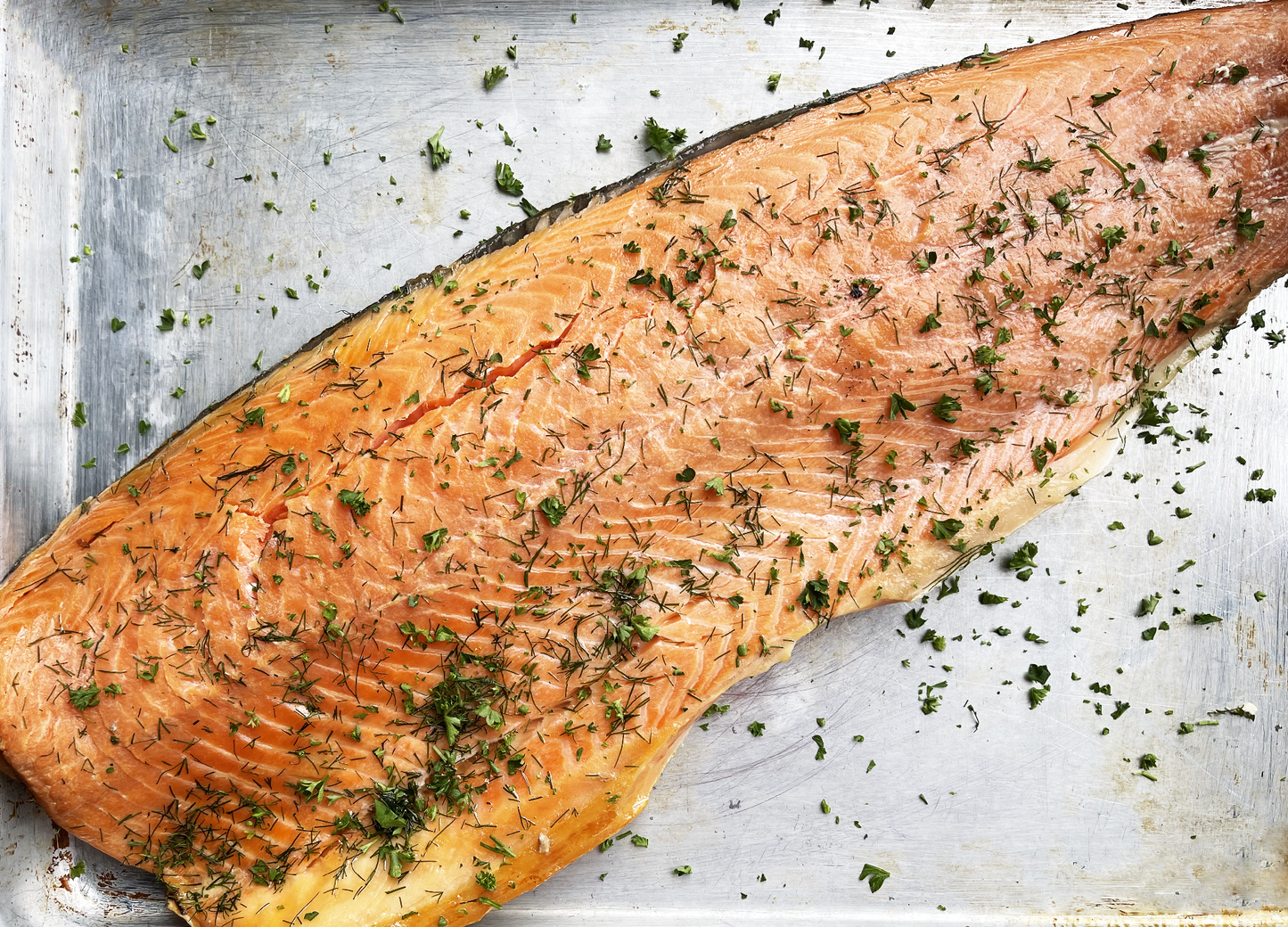 JenChan's - Our in house Smoked Salmon 8 ounces of salmon per portion OR Whole Salmon Side Perfect on a Bagel with some cream cheese, farm tomatoes, and capers. Or try it on a salad; it is quite delicious seared just as you would enjoy a salmon filet.