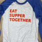 Soft, comfortable gray and blue baseball jersey style T shirt with 3/4 length sleeves. Text on front reads "EAT SUPPER TOGETHER"