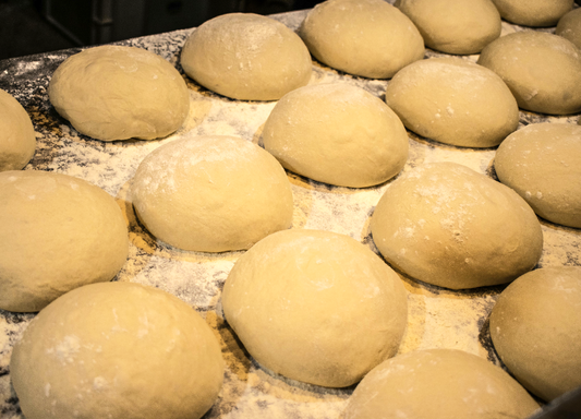 JenChan's house made dough balls. Made with a super special flour blend and a touch of semolina, with our Mother Sourdough starter...this dough is perfect for making your own pizzas or breadsticks. 1 lb dough ball
