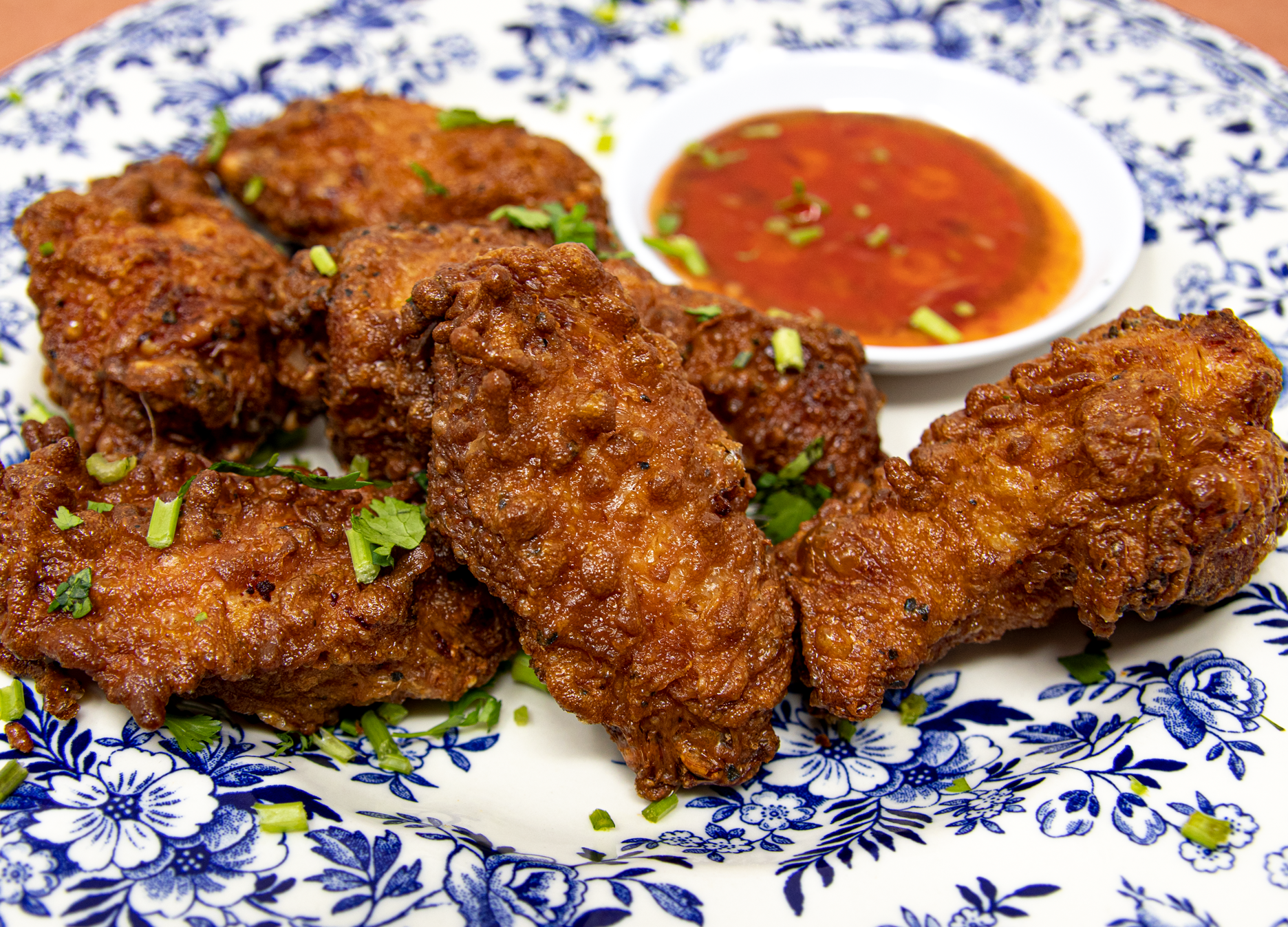 Shaoxing Wine, Soy, Ginger, Sesame Marinated Chicken Wings served with Mai Ploy Sweet Chili Sauce (6 wings per order)  This Product contains GLUTEN